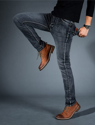 Men's stretch denim jeans, blue slim fit, slim leg with tan leather patch