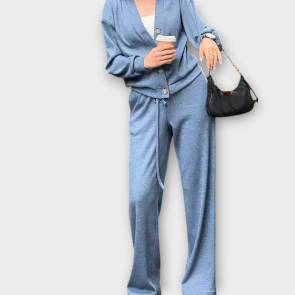 Blue cardigan and drawstring trouser set, button front, relaxed long-sleeve fit.