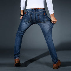 Men's stretch denim jeans, dark blue slim fit, rear pockets with tan leather trim