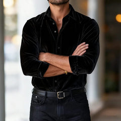 Black velvet button-up shirt with long sleeves and pointed collar.