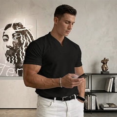 Black short-sleeve V-neck tee on model, side view with fitted waist