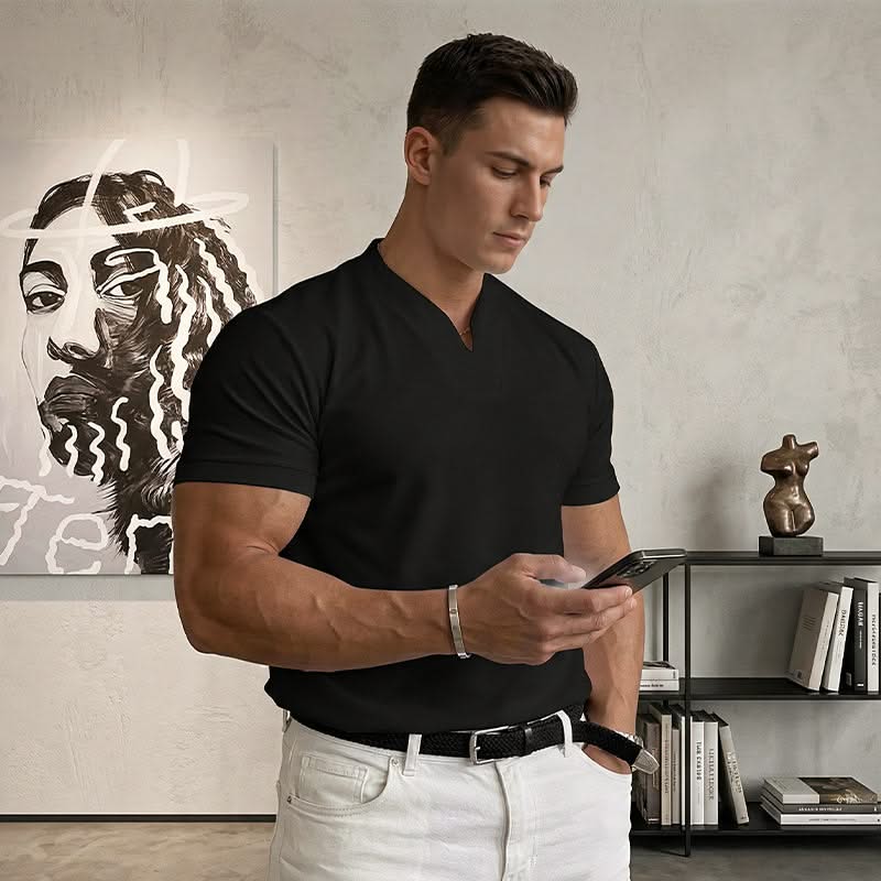 Black short-sleeve V-neck tee on model, side view with fitted waist