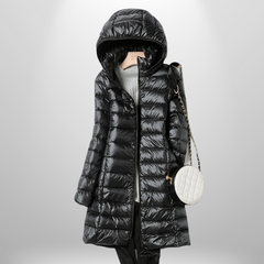 Black hooded ultralight puffer down jacket with full-length zip and long coat hem.