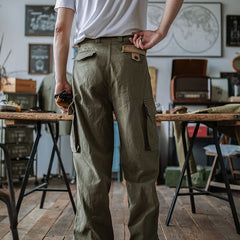 Army green cargo trousers with stacked cargo pockets and adjustable waistband