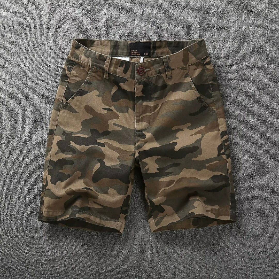 Desert camo tactical flex shorts with belt loops, button fly, and side pockets
