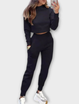 Black casual tracksuit set with cropped sweatshirt and matching jogger pants