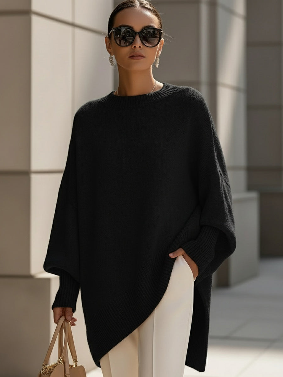 Black drop-shoulder knit jumper with ribbed crew neck and draped asymmetrical hem
