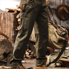 Army green straight-leg utility pants with zip fly and roomy thigh pockets