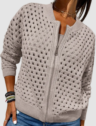 Light beige openwork knitted cardigan with full front zipper and ribbed cuffs and hem