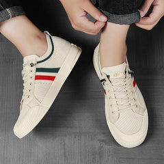 Sandstone knit sneakers worn; close view of toe and side stripe with lace-up laces