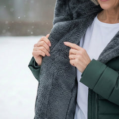 Grey fleece lining inside a hooded puffer coat, shown in a close-up