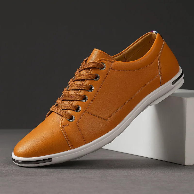 Brown leather low-top sneaker with lace-up front and white rubber sole
