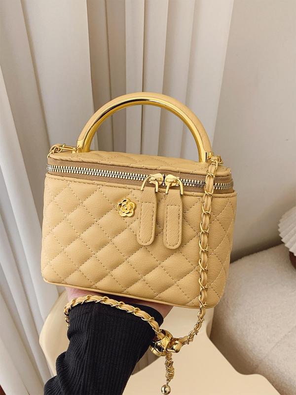 Beige quilted crossbody bag with gold-tone chain strap and top zip closure