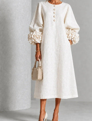 White floral midi dress with button front and rose-cuff puff sleeves, front view