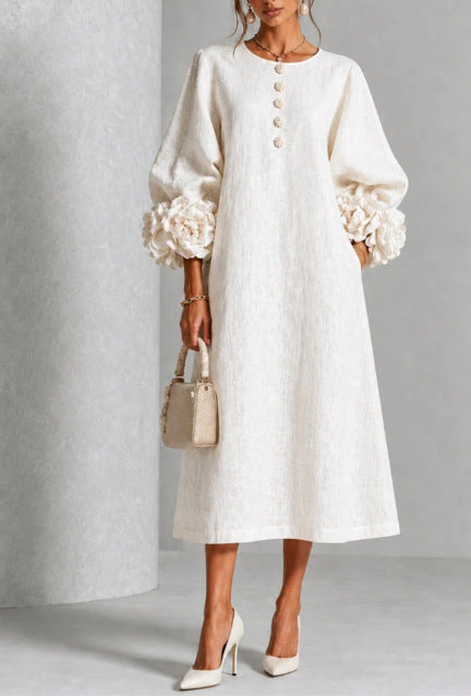 White floral midi dress with button front and rose-cuff puff sleeves, front view