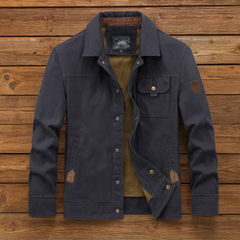 Navy utility jacket with button front, flap pockets, and diagonal inner lining detail