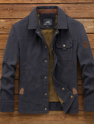 Navy utility jacket with button front, flap pockets, and diagonal inner lining detail