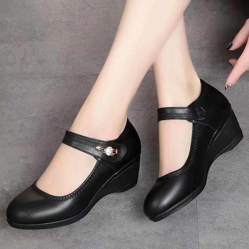 Black Mary Jane wedge heels with T-strap and small decorative buckle