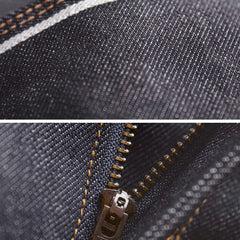Denim jeans close-up of zipper fly with contrast tan stitching and metal pull