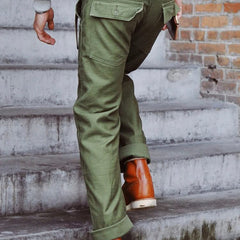 Olive green straight fatigue pants with back patch pocket and cuffed ankle hem