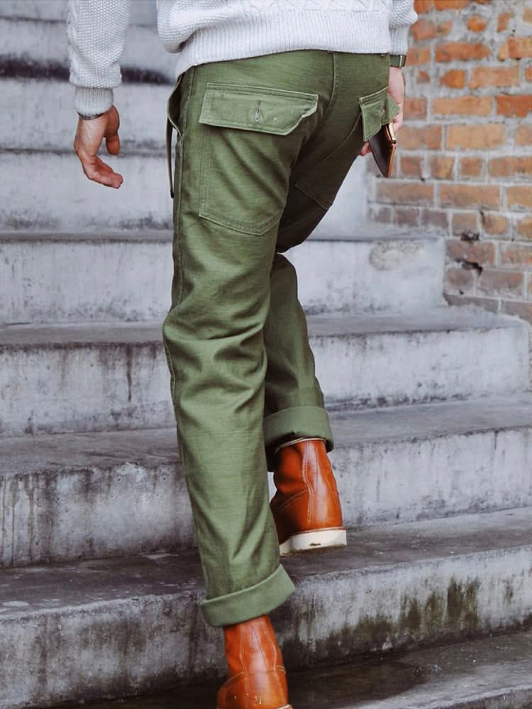 Olive green straight fatigue pants with back patch pocket and cuffed ankle hem