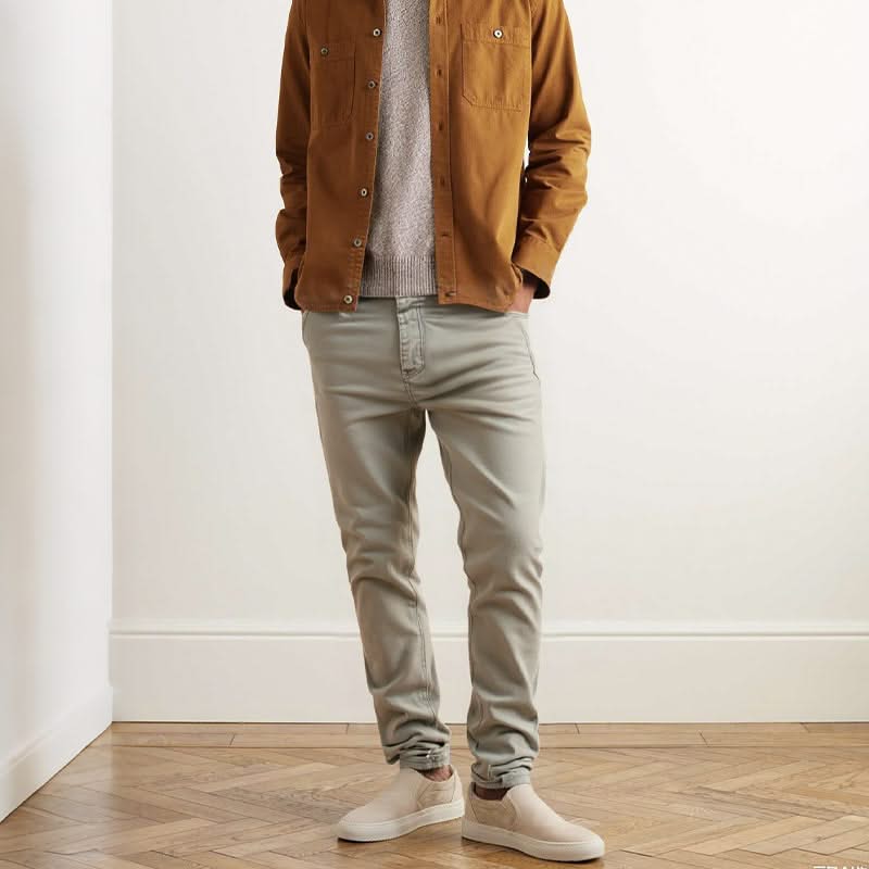 Beige slim trousers with button closure, belt loops, and slim tapered fit