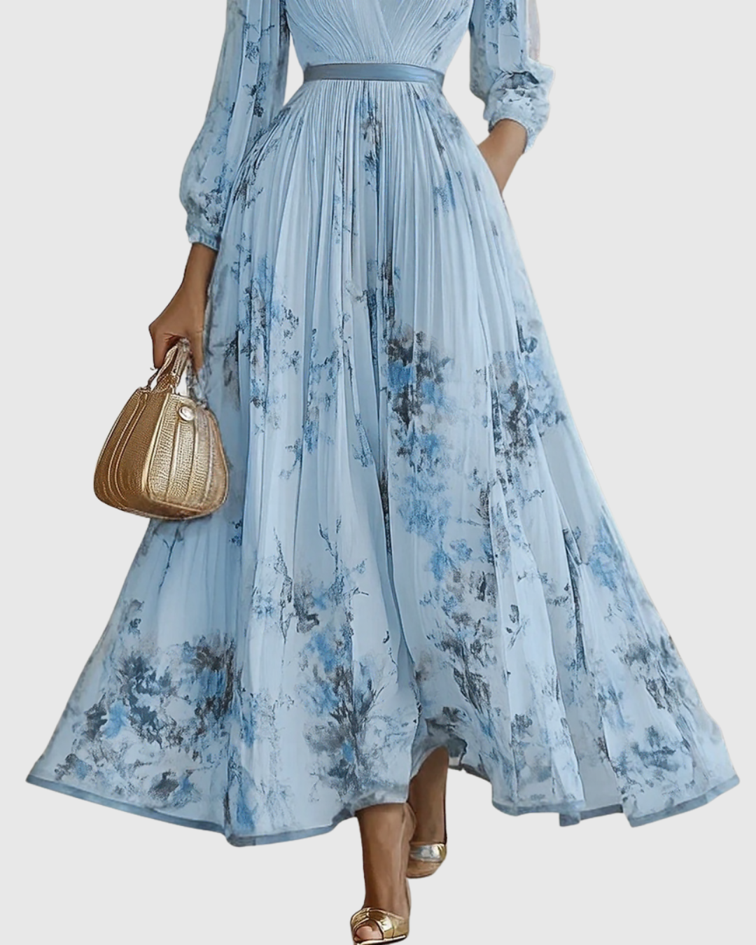 Light blue pleated maxi skirt with vertical pleats and blue floral print, long sleeves.