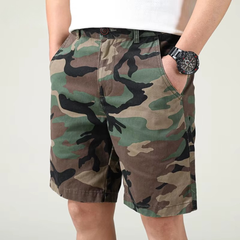 Camouflage tactical flex shorts worn at thigh length with belt loops and button fly
