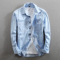 Light blue classic-fit button-front shirt with chest pockets and buttoned collar