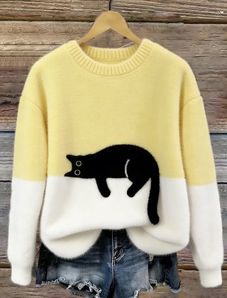 Yellow oversized sweater with white hem and cuffs, featuring a black penguin front graphic.