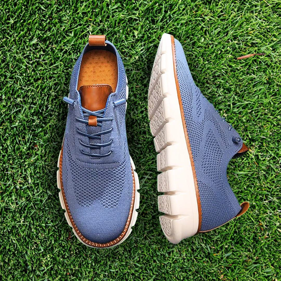 Blue knit lace-up walking shoes with brown lining accents and thick white sole