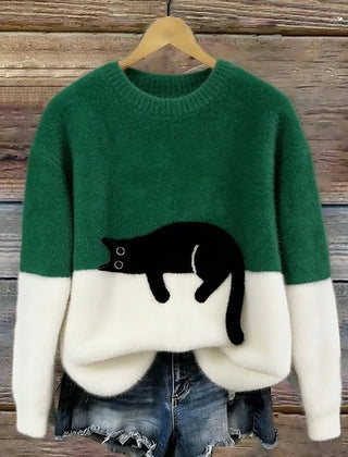 Green oversized sweater with white hem and cuffs, featuring a black penguin front graphic.