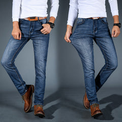 Men's stretch denim jeans, blue slim fit, belt loops and tan-brown waistband patch