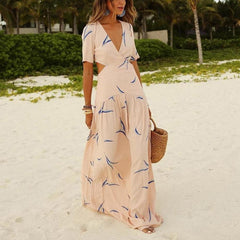 Apricot maxi dress with short sleeves, V-neck, and blue abstract print; tied waist
