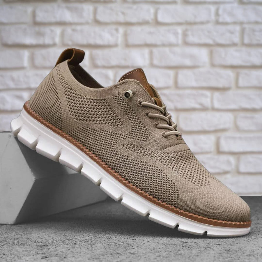 Beige knit walking shoes with lace-up front, brown heel tab, and white cushioned sole