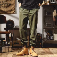Olive green cargo pants with side cargo pocket and elastic waistband