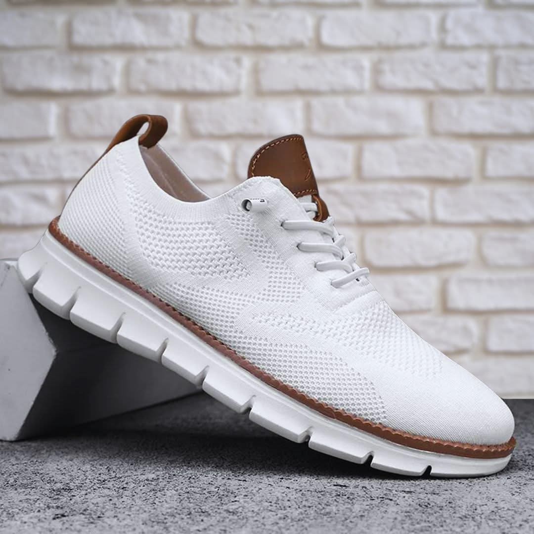 White lace-up walking shoes with brown-trim edge and chunky white tread sole