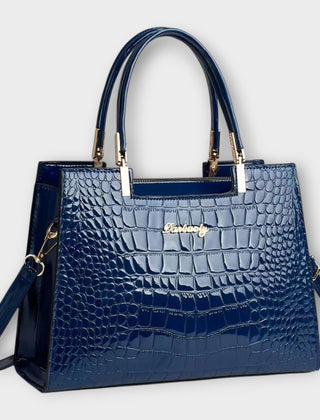 Shiny crocodile-pattern handbag in blue with top handles and crossbody strap
