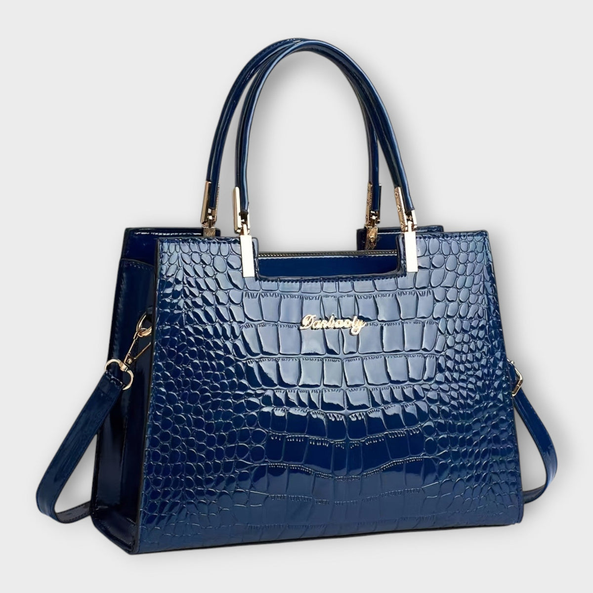Shiny crocodile-pattern handbag in blue with top handles and crossbody strap