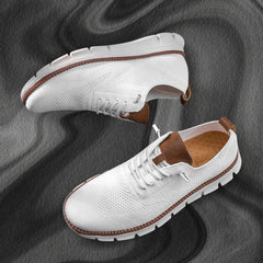 White lace-up walking shoes with brown-trimmed sole and cushioned platform