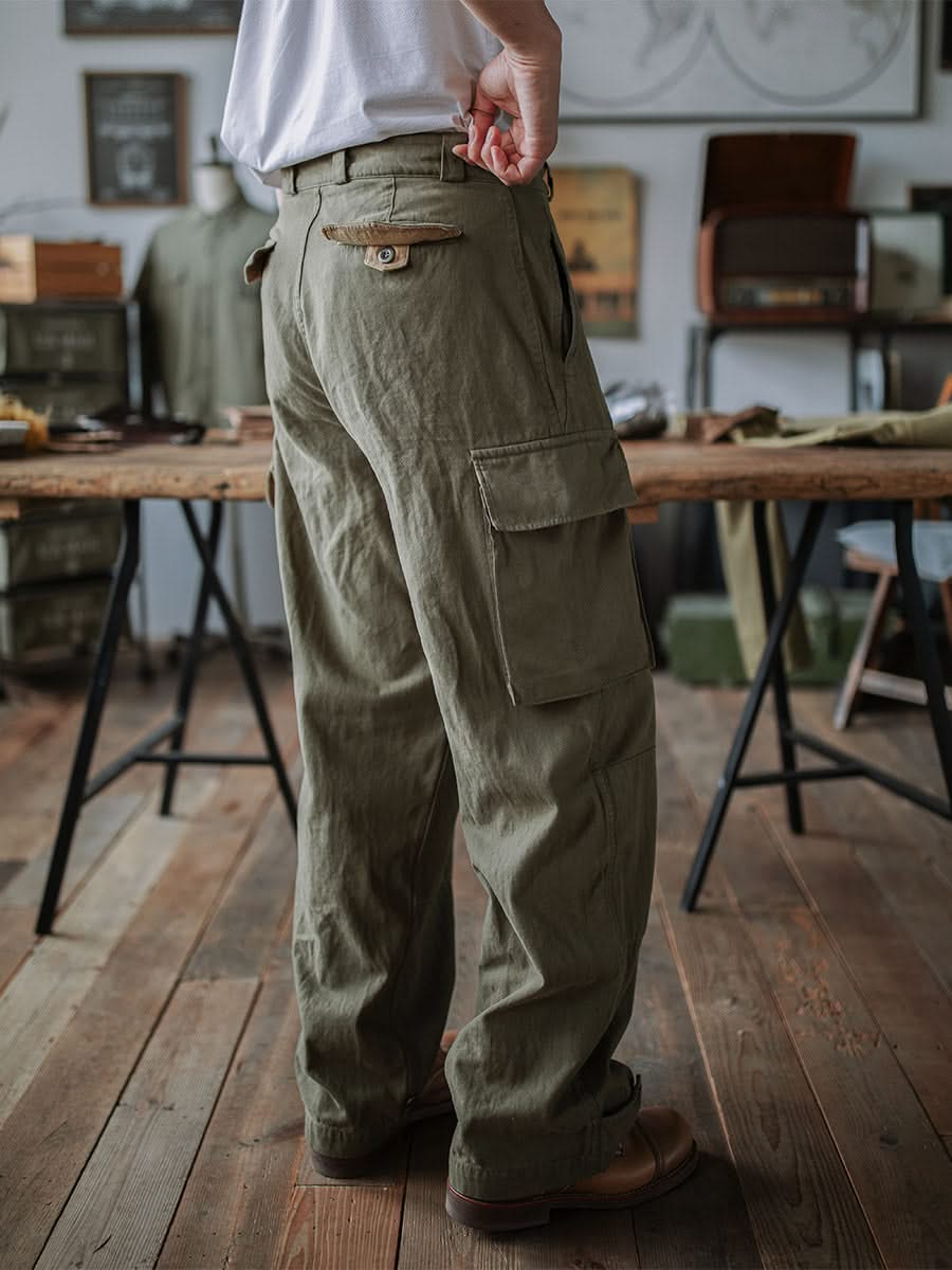 Army green cargo trousers with front button fly and flap cargo pockets