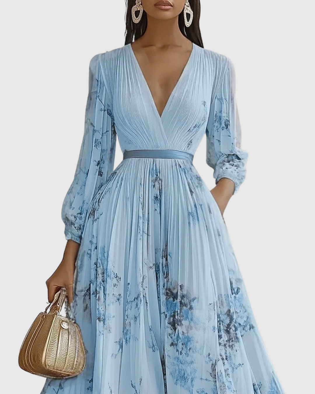 Light blue pleated maxi dress with V-neck wrap bodice and floral print, long sleeves.
