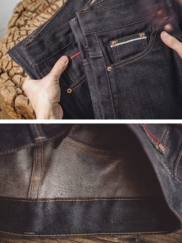Indigo denim jeans with front pocket, visible lining, and contrast orange topstitching