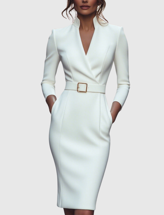 White fitted midi dress with V-neck, long sleeves, and tan square buckle waist belt.