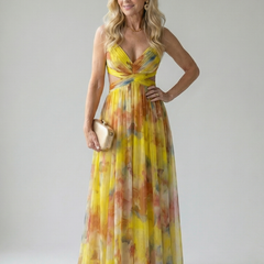 Yellow multicolor maxi wrap dress with V-neck, sleeveless cut, and twisted waist tie.
