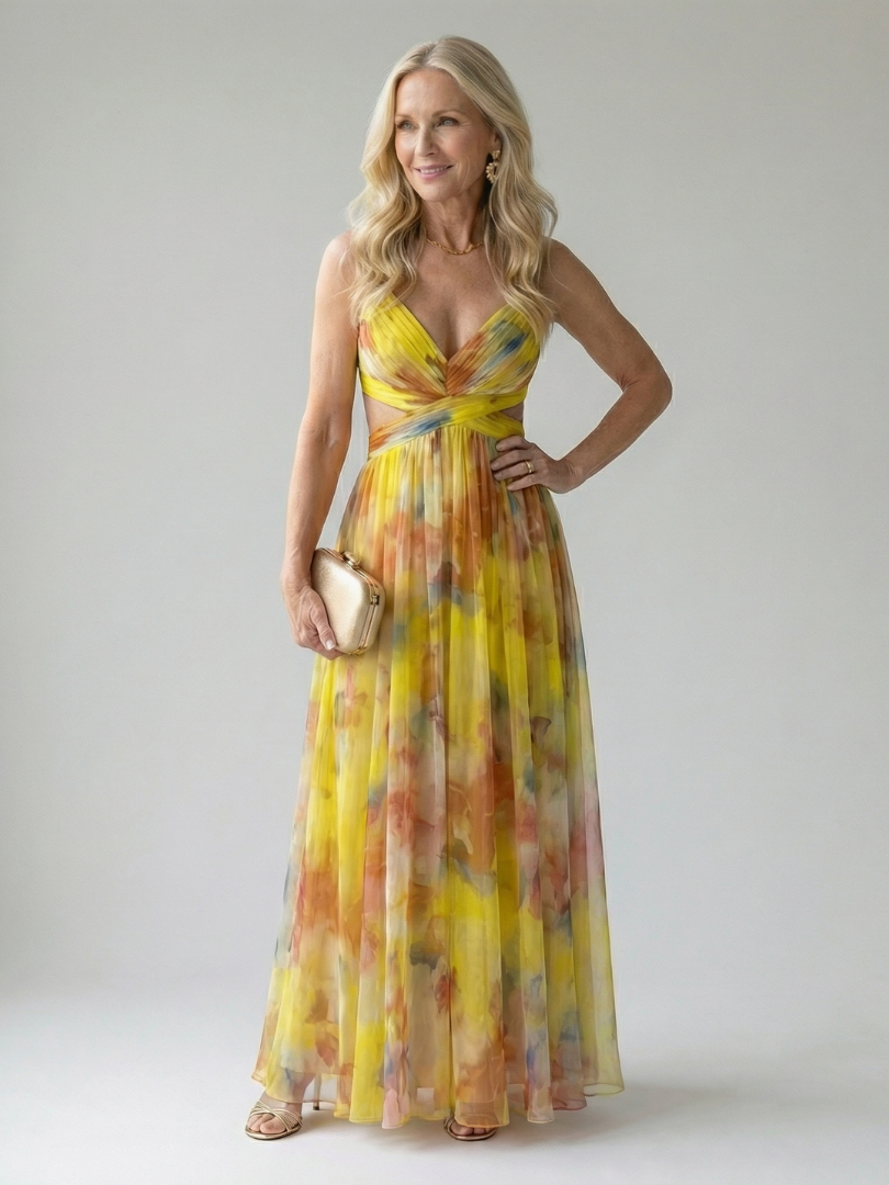 Yellow multicolor maxi wrap dress with V-neck, sleeveless cut, and twisted waist tie.