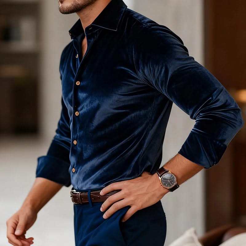 Navy velvet button-up shirt with long sleeves and pointed collar, side view.