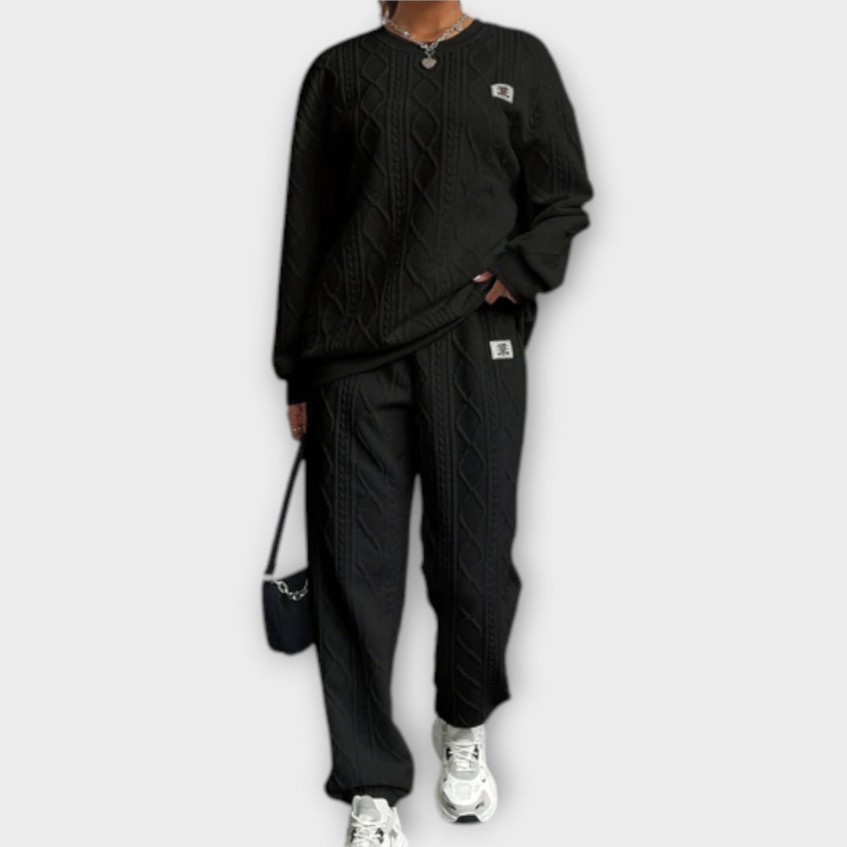 Black cable-knit casual set: round-neck long-sleeve top and matching jogger pants