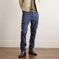 Navy blue slim trousers with button closure, belt loops, and tapered legs
