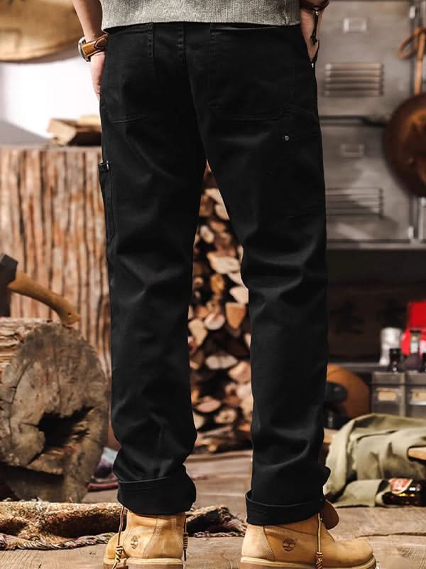 Black straight-leg utility pants with front pockets and cuffed hem